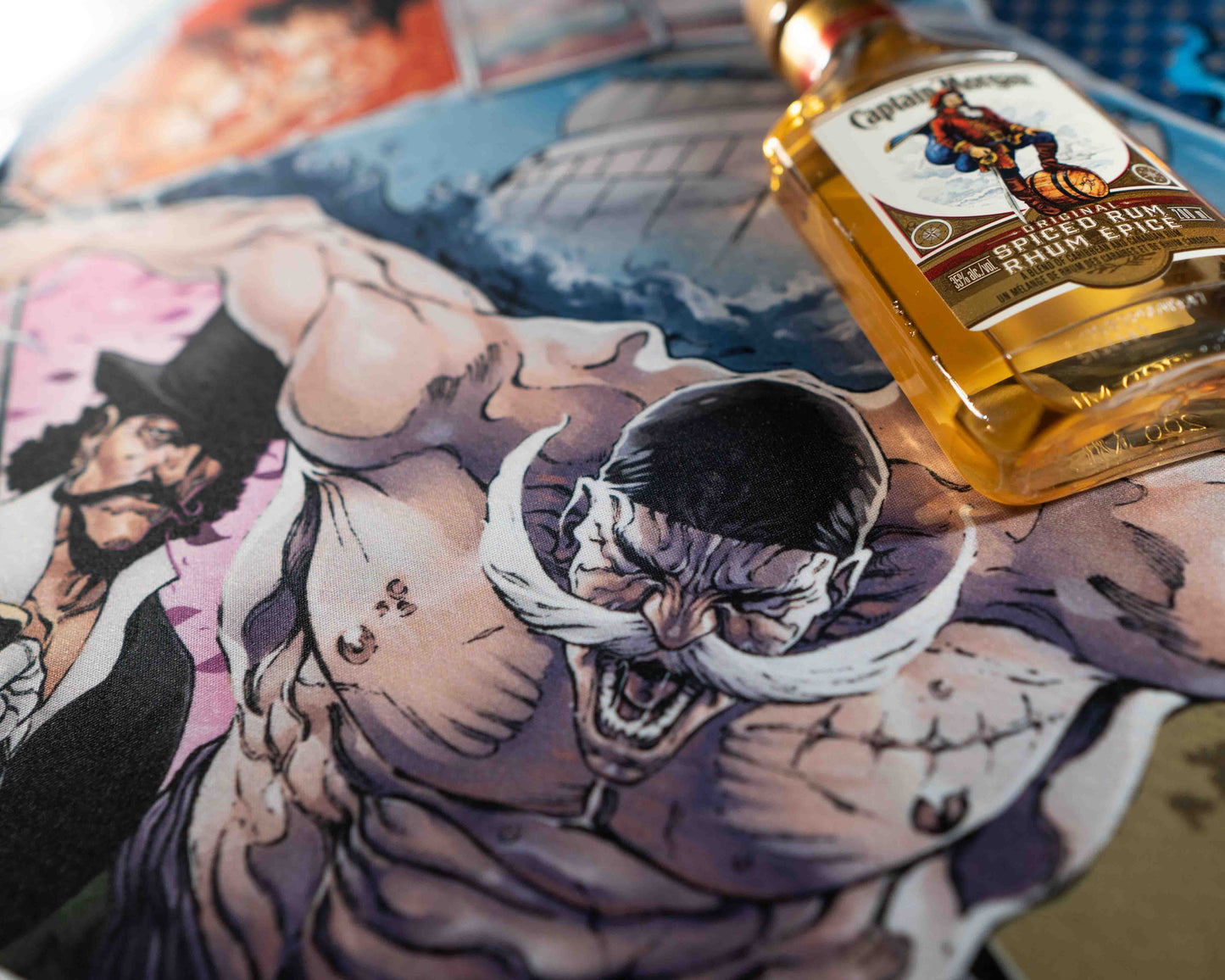 closeup of the world's strongest man with an intense look as he smashes the mat, featuring a bottle of Captain Morgan's Spiced Rum as a prop