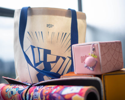 OPTCG Tote Bag styled with other OPTCG merchandise