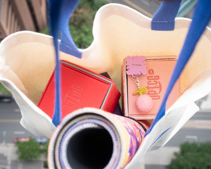 OPTCG Tote Bag side angle with merchandise inside