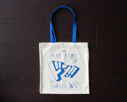 OPTCG Tote Bag full view on dark wood background